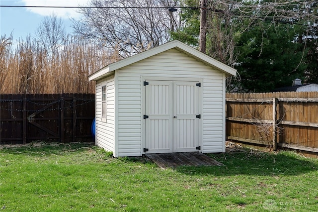 view of shed featuring a fenced backyard