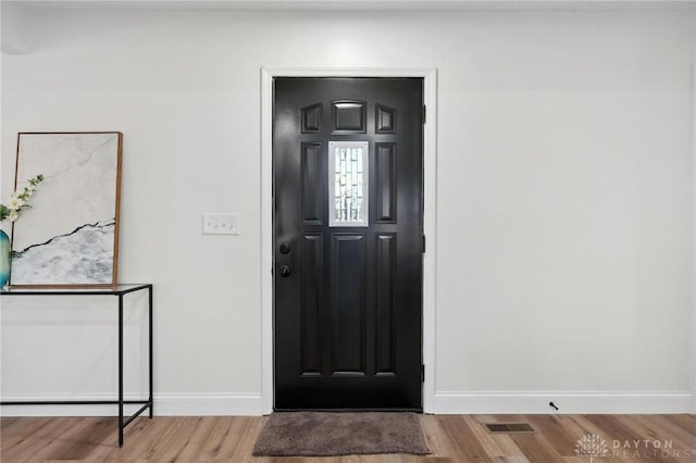 5850 Weidner Rd, Springboro, OH 45066 - entryway with wood finished floors and baseboards