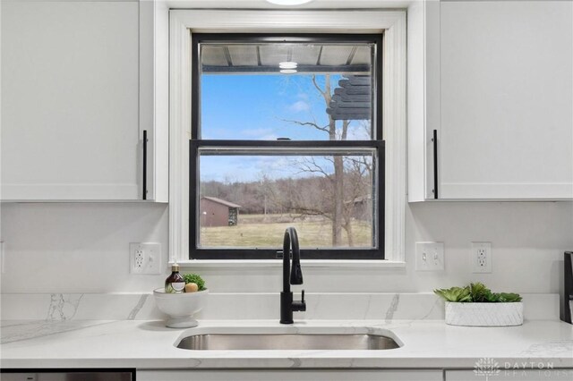 5850 Weidner Rd, Springboro, OH 45066 - room details with dishwasher, white cabinetry, and a sink