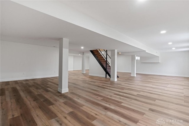 5850 Weidner Rd, Springboro, OH 45066 - finished below grade area featuring wood finished floors, baseboards, and stairway