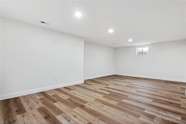 5850 Weidner Rd, Springboro, OH 45066 - below grade area featuring light wood finished floors, baseboards, visible vents, and recessed lighting