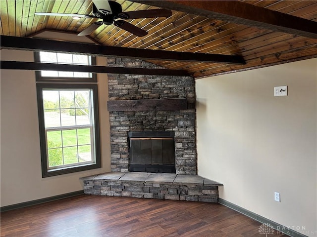 unfurnished living room featuring baseboards, vaulted ceiling with beams, wooden ceiling, and wood finished floors