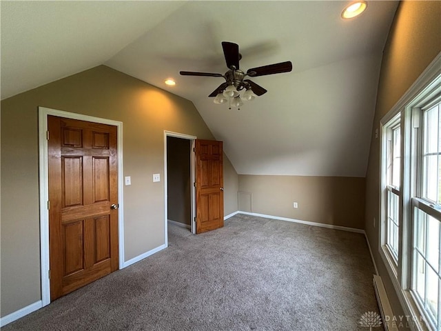 additional living space with ceiling fan, recessed lighting, carpet floors, lofted ceiling, and baseboards