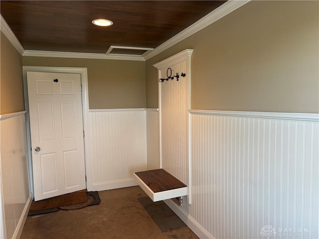 mudroom with crown molding, carpet flooring, and a wainscoted wall