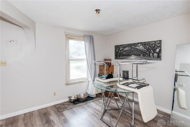 office featuring wood finished floors and baseboards