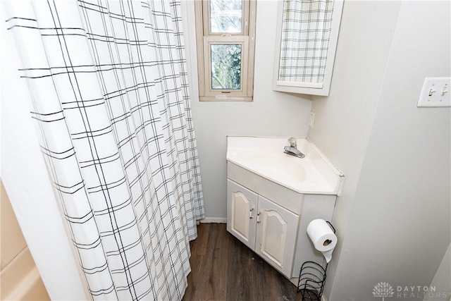 bathroom featuring wood finished floors, vanity, and a shower with curtain