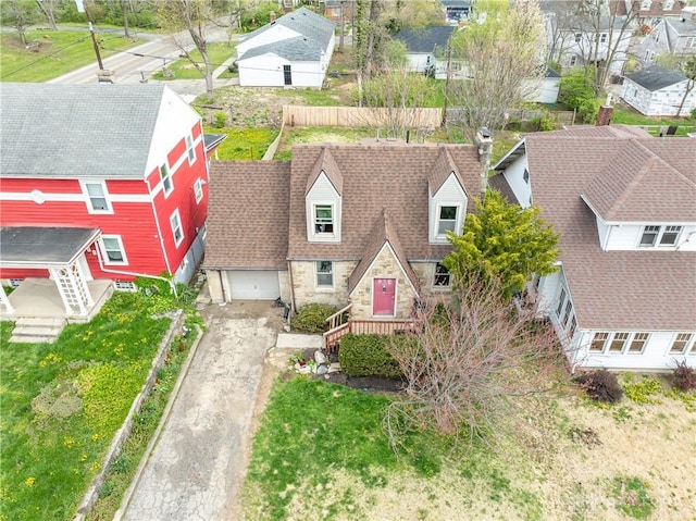 birds eye view of property with a residential view