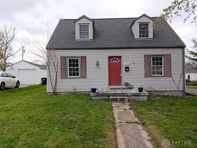2025 Malcom Dr, Dayton, OH 45420 - new england style home with a garage, a front yard, an outbuilding, and roof with shingles