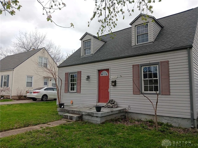 2025 Malcom Dr, Dayton, OH 45420 - new england style home with a front yard and a shingled roof
