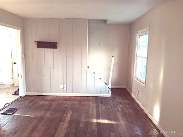 2025 Malcom Dr, Dayton, OH 45420 - empty room with wood-type flooring, baseboards, and wood walls