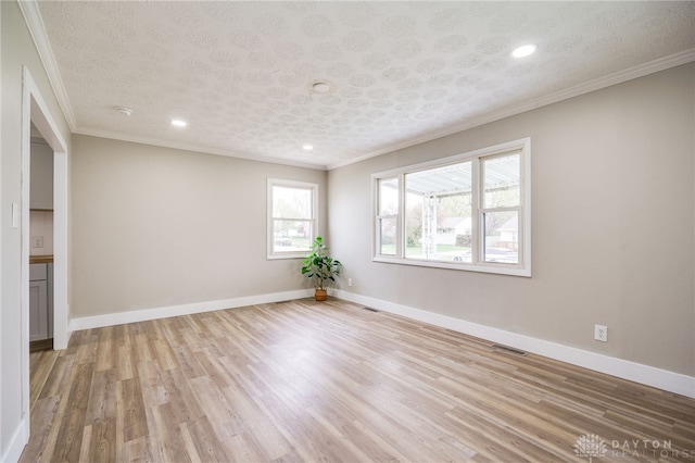 empty room featuring recessed lighting, crown molding, visible vents, and light wood-style flooring