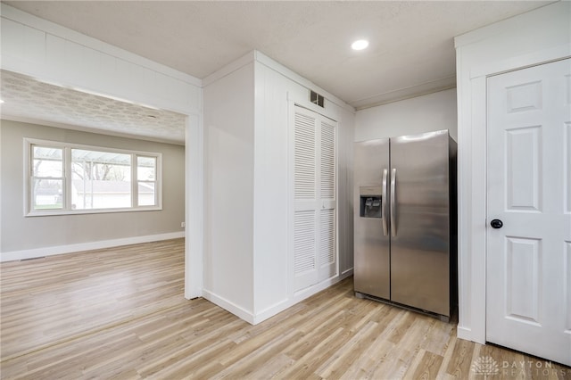 kitchen with recessed lighting, visible vents, light wood-type flooring, baseboards, and stainless steel refrigerator with ice dispenser