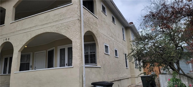 view of side of home featuring stucco siding