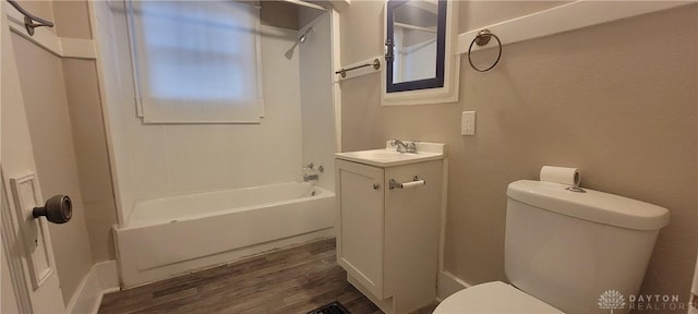 full bathroom with toilet, wood finished floors, vanity, and bathtub / shower combination