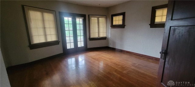 interior space featuring wood finished floors and baseboards