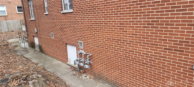 view of side of home with brick siding