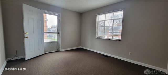 interior space featuring visible vents, baseboards, and plenty of natural light