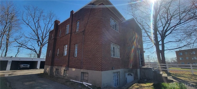 view of home's exterior featuring brick siding