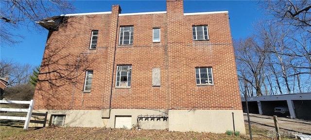 view of building exterior featuring fence