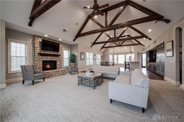 1198 Normandy Rue, Springboro, OH 45458 - carpeted living area featuring high vaulted ceiling, visible vents, baseboards, and beamed ceiling