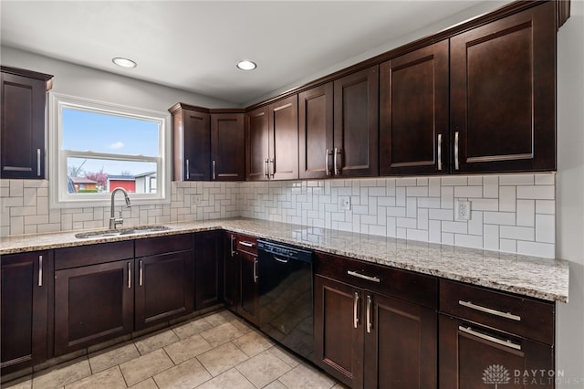 kitchen with light tile patterned floors, dishwasher, a sink, and light stone counters