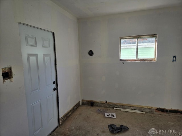 interior space featuring baseboards