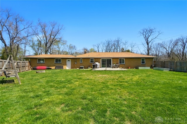 1111 Darlington Dr, Beavercreek, OH 45434 - back of house featuring a patio, cooling unit, and a chimney
