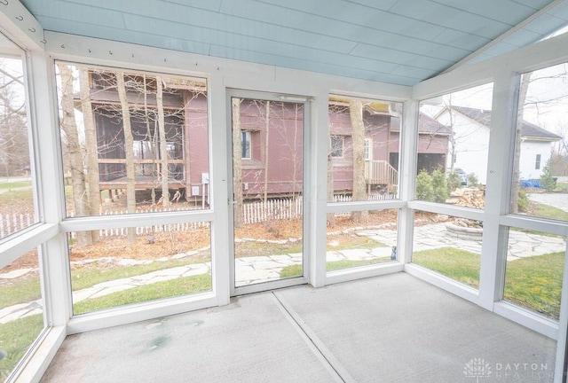 unfurnished sunroom featuring a wealth of natural light