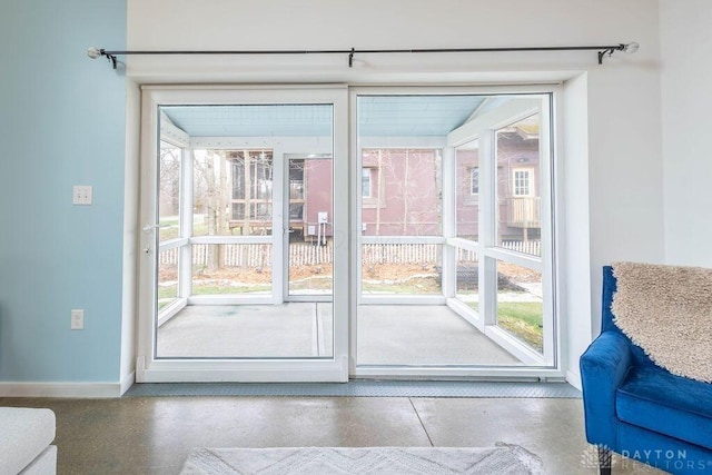 entryway featuring baseboards