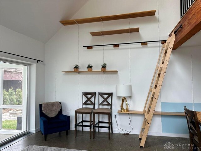 sitting room featuring vaulted ceiling
