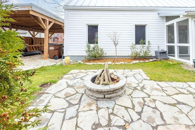 view of patio / terrace with fence and an outdoor fire pit