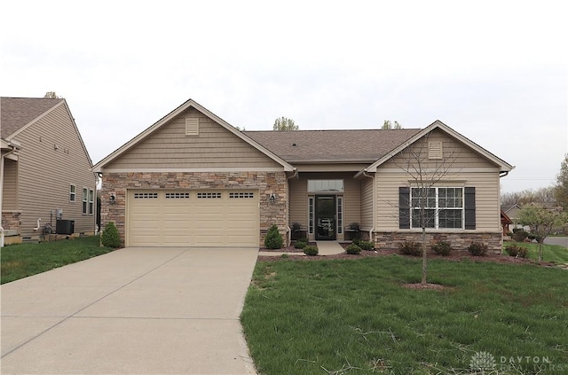view of front of house featuring central AC, driveway, stone siding, an attached garage, and a front yard
