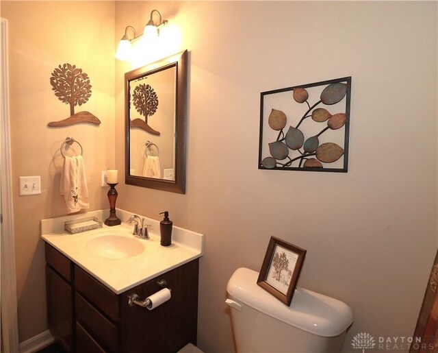 bathroom with toilet and vanity