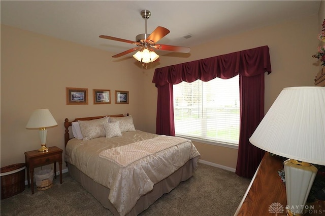 bedroom with visible vents, a ceiling fan, baseboards, and carpet floors