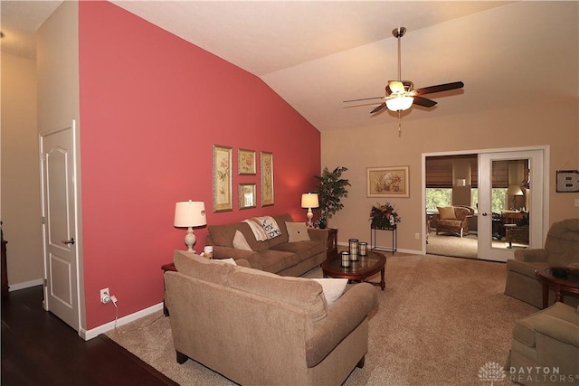living room featuring ceiling fan, vaulted ceiling, french doors, and baseboards