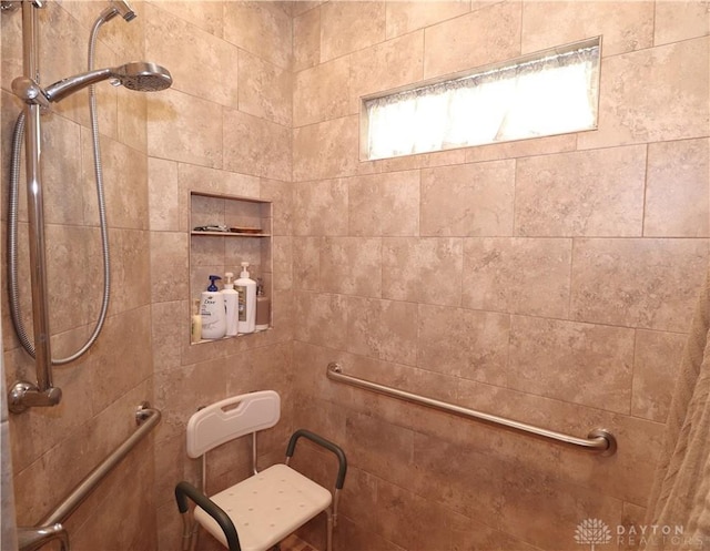 full bath featuring tiled shower