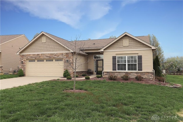 view of front of property with concrete driveway, an attached garage, stone siding, and a front yard