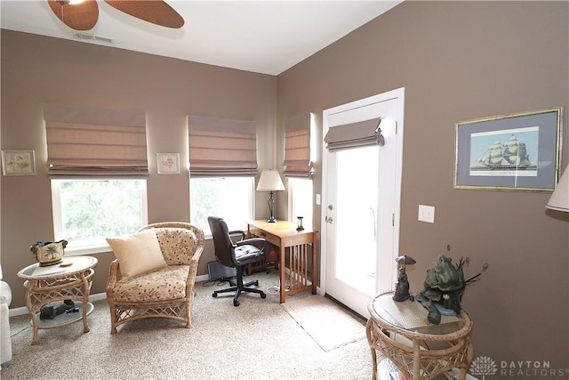 office space featuring a ceiling fan and visible vents