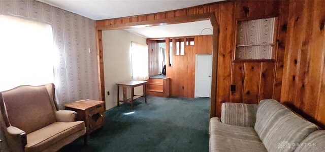 305 S Ada Doty St, Gratis, OH 45330 - living area featuring carpet flooring, wallpapered walls, healthy amount of natural light, and wood walls