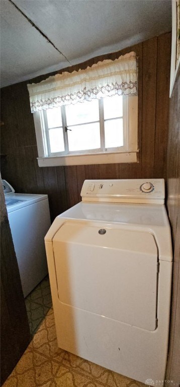 305 S Ada Doty St, Gratis, OH 45330 - laundry room featuring washer / dryer, wooden walls, and light flooring