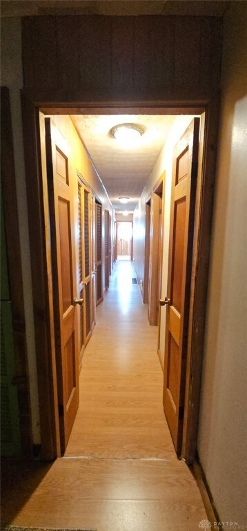 305 S Ada Doty St, Gratis, OH 45330 - corridor featuring light wood finished floors