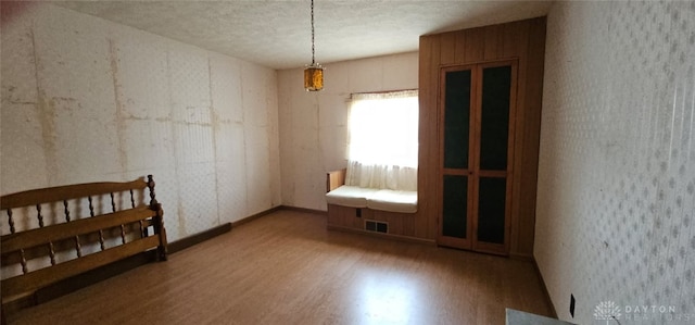 305 S Ada Doty St, Gratis, OH 45330 - unfurnished bedroom featuring wood finished floors and a textured ceiling
