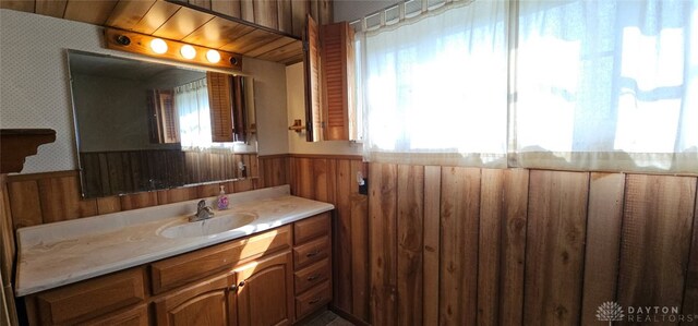 305 S Ada Doty St, Gratis, OH 45330 - bathroom featuring a wainscoted wall, vanity, wood walls, and wallpapered walls