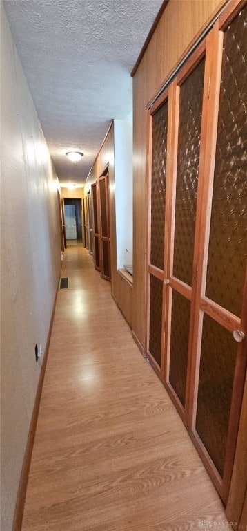 305 S Ada Doty St, Gratis, OH 45330 - hallway featuring light wood finished floors and a textured ceiling