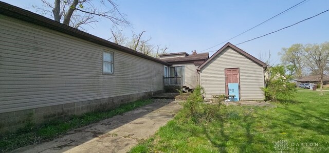 305 S Ada Doty St, Gratis, OH 45330 - view of side of property with a yard