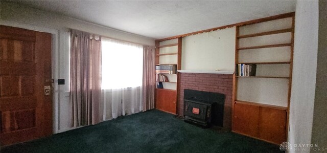 305 S Ada Doty St, Gratis, OH 45330 - unfurnished living room with dark carpet and a fireplace