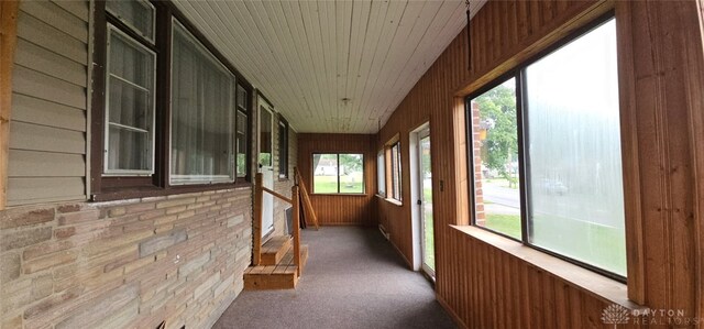 305 S Ada Doty St, Gratis, OH 45330 - unfurnished sunroom featuring wooden ceiling, wooden walls, and carpet floors