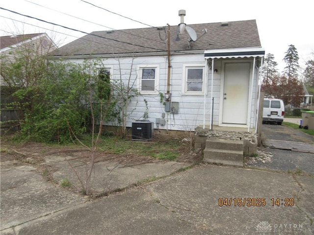 1329 Lamar Dr, Springfield, OH 45504 - back of house with roof with shingles and central AC