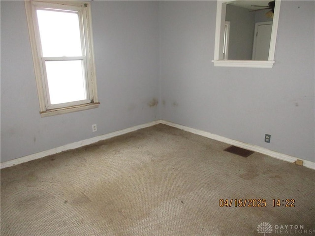 1329 Lamar Dr, Springfield, OH 45504 - empty room featuring visible vents, baseboards, a ceiling fan, and carpet flooring