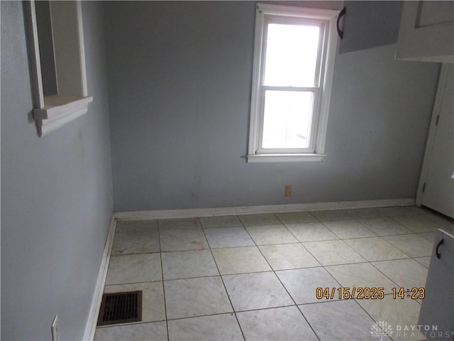 1329 Lamar Dr, Springfield, OH 45504 - empty room featuring baseboards, light tile patterned flooring, and visible vents
